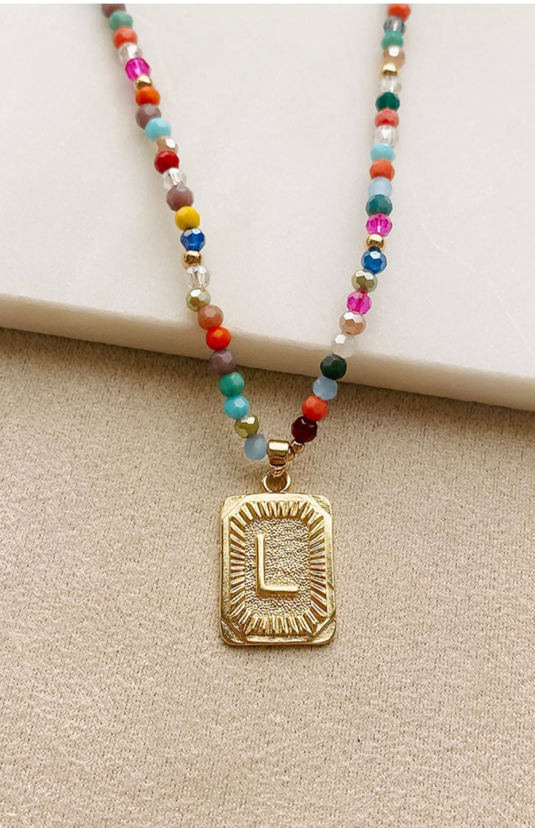 Multi colored beaded initials necklace